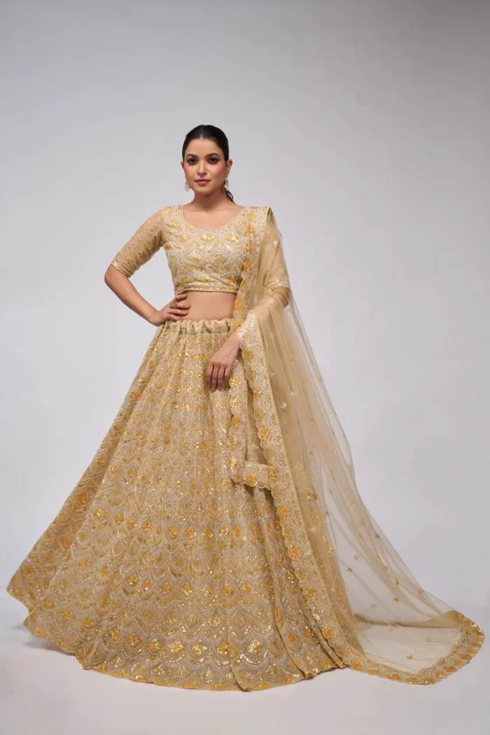 golden color leaves pattern sequins embroidered soft net bridal lehenga choli