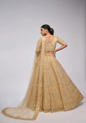 golden color leaves pattern sequins embroidered soft net bridal lehenga choli