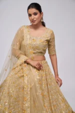 golden color leaves pattern sequins embroidered soft net bridal lehenga choli