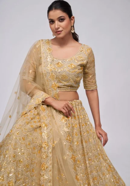 golden color leaves pattern sequins embroidered soft net bridal lehenga choli