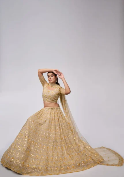 golden color leaves pattern sequins embroidered soft net bridal lehenga choli