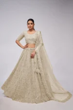 white ivory color leaves pattern sequins embroidered soft net bridal lehenga choli