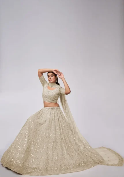 white ivory color leaves pattern sequins embroidered soft net bridal lehenga choli