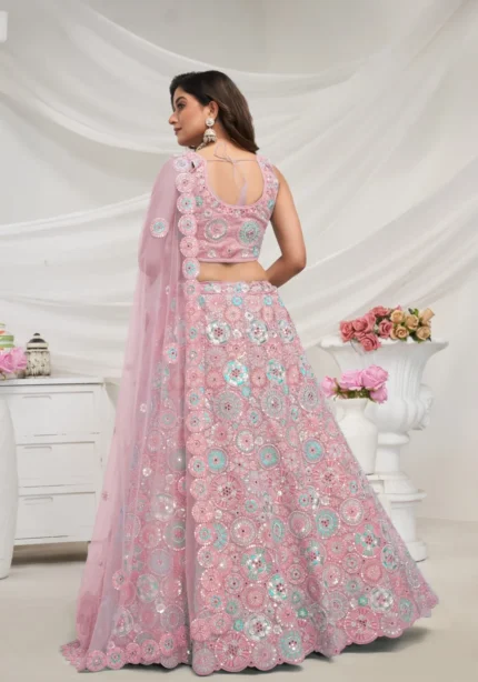 mauve pink color soft net fabric multi color thread radiant mirror and sequence work embroidered bridal lehenga choli