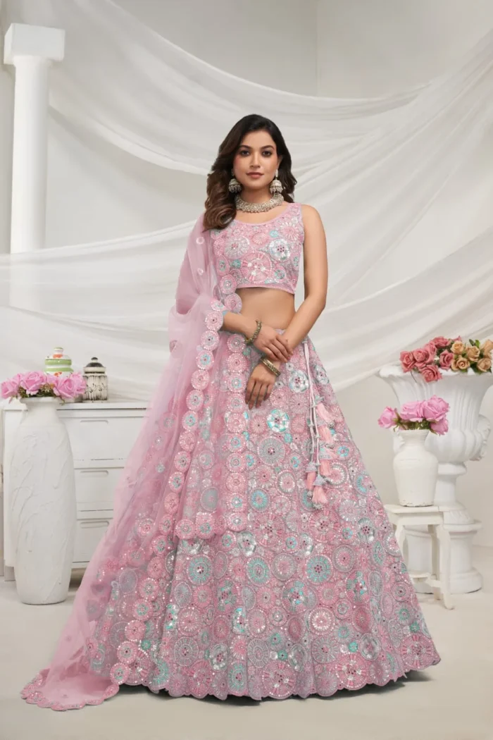 mauve pink color soft net fabric multi color thread radiant mirror and sequence work embroidered bridal lehenga choli