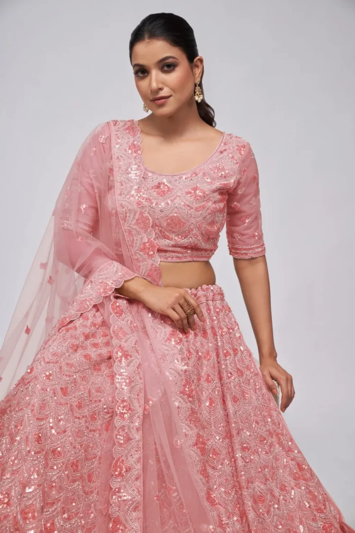 pink color leaves pattern sequins embroidered soft net bridal lehenga choli