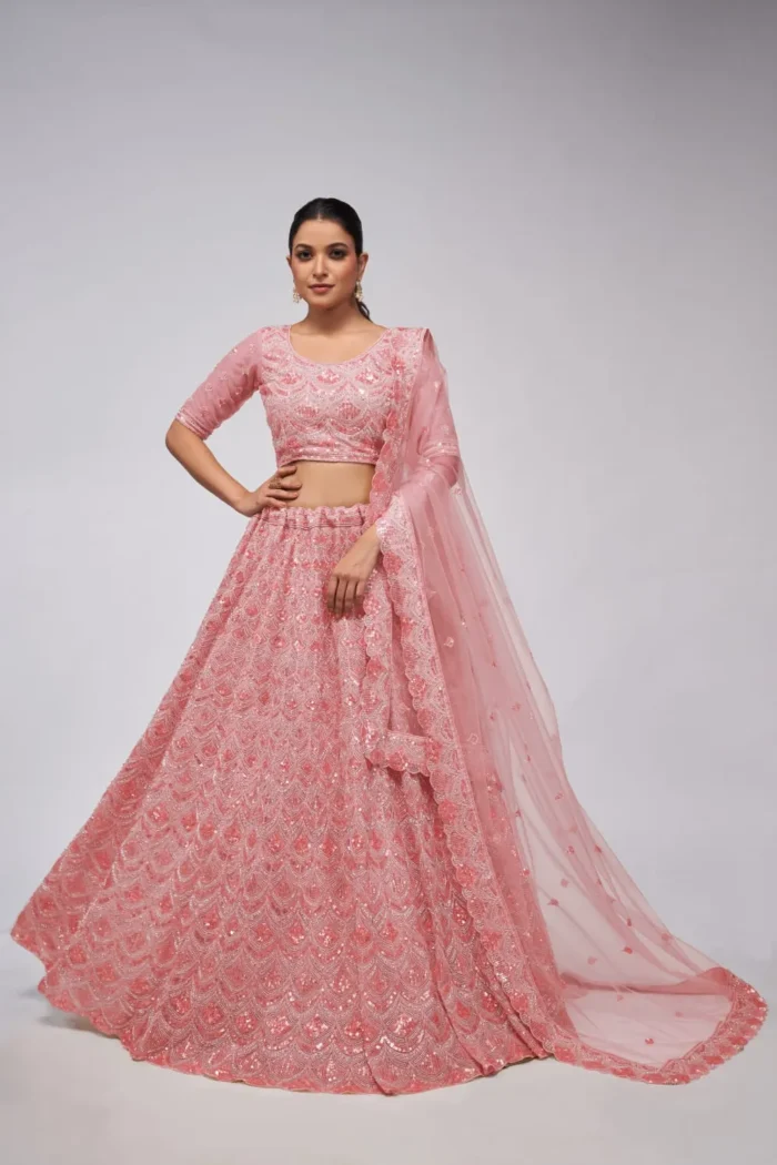 pink color leaves pattern sequins embroidered soft net bridal lehenga choli