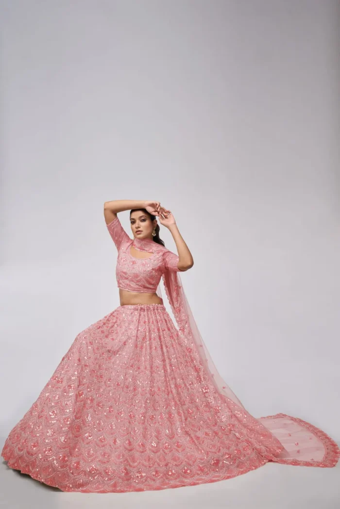 pink color leaves pattern sequins embroidered soft net bridal lehenga choli