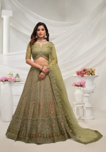 Green color lehenga with intricate paisley floral motifs embedded with shimmering rhinestones and zari work with soft net fabric bridal lehenga choli