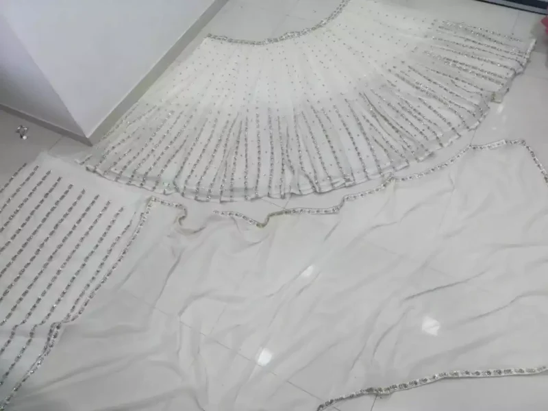 off white color georgette fabric embroidered party wear lehenga choli