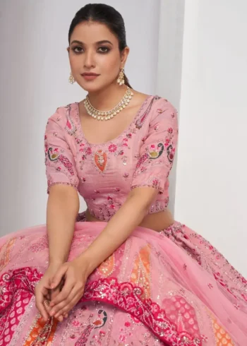 pink color Intricately embroidered paisely motifs surrounded sequins embroidered bridal lehenga choli
