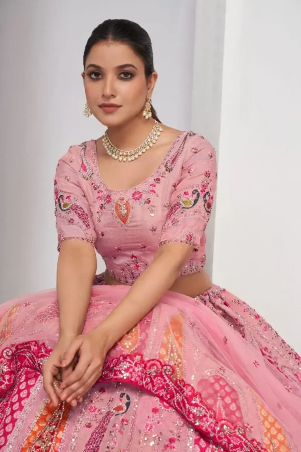 pink color Intricately embroidered paisely motifs surrounded sequins embroidered bridal lehenga choli