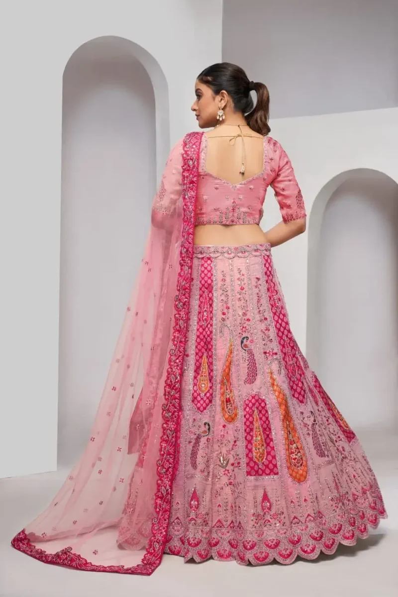 pink color Intricately embroidered paisely motifs surrounded sequins embroidered bridal lehenga choli
