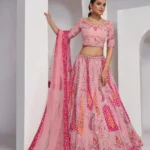 pink color Intricately embroidered paisely motifs surrounded sequins embroidered bridal lehenga choli