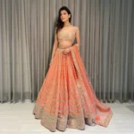 Orange Devsena Silk Embroidered Party Wear and Wedding Lehenga