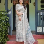 Cream and Beige Linen Saree With Elegant Blue Floral and Paisley Motifs