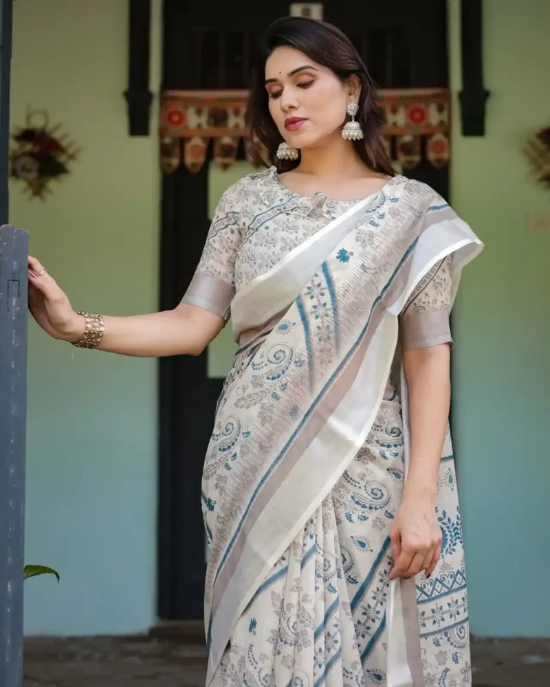 Cream and Beige Linen Saree With Elegant Blue Floral and Paisley Motifs