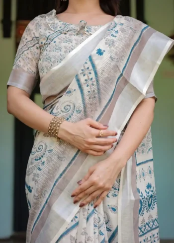 Cream and Beige Linen Saree With Elegant Blue Floral and Paisley Motifs