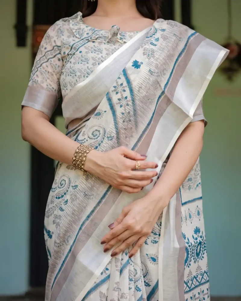 Cream and Beige Linen Saree With Elegant Blue Floral and Paisley Motifs