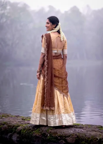 Village girl wearing Cream Colour Kanchipuram Half Saree Lehenga back side look