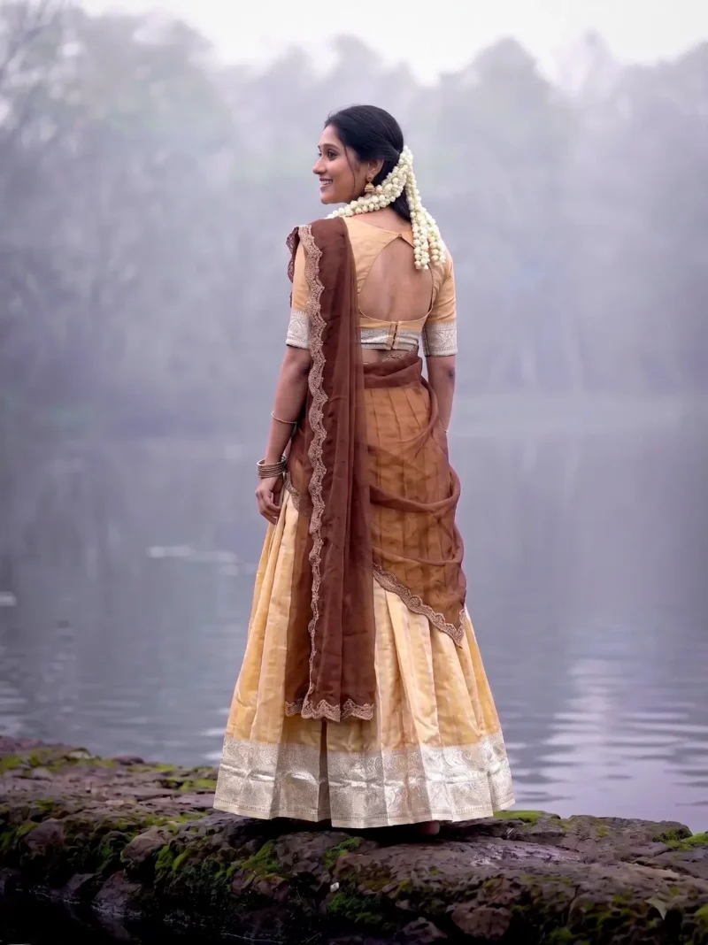 Village girl wearing Cream Colour Kanchipuram Half Saree Lehenga back side look