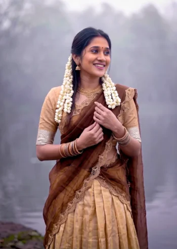 Village girl wearing Cream Colour Kanchipuram Half Saree Lehenga close look