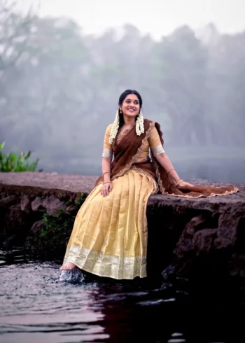 Village girl wearing Cream Colour Kanchipuram Half Saree Lehenga