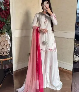 Girl wearing white salwar suit with pink dupatta
