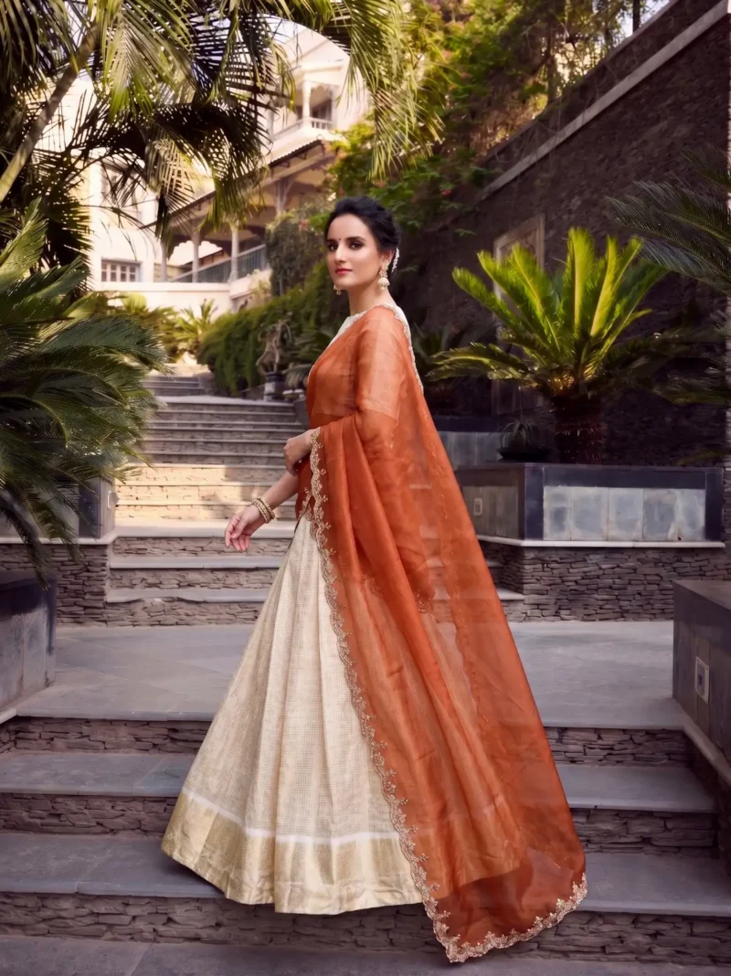 Off White Jacquard Half Saree Lehenga with Orange dupatta side look