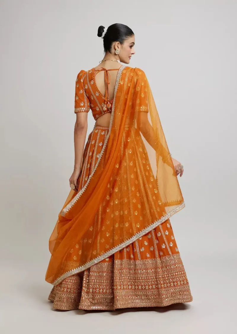Orange Colour Georgette Haldi Lehenga back side look
