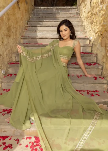 Pastel Green Faux Georgette Bridesmaid Lehenga model lying on stair