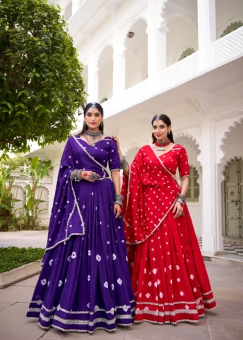 Two girls wearing Purple and Red Colour Pure Chanderi Bandhej Navratri Lehenga