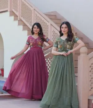 Two girls wearing designer gown