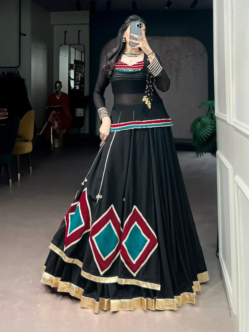 Black Marble Navratri Lehenga with Cowrie Bell Detailing and Sheer Tunic front look