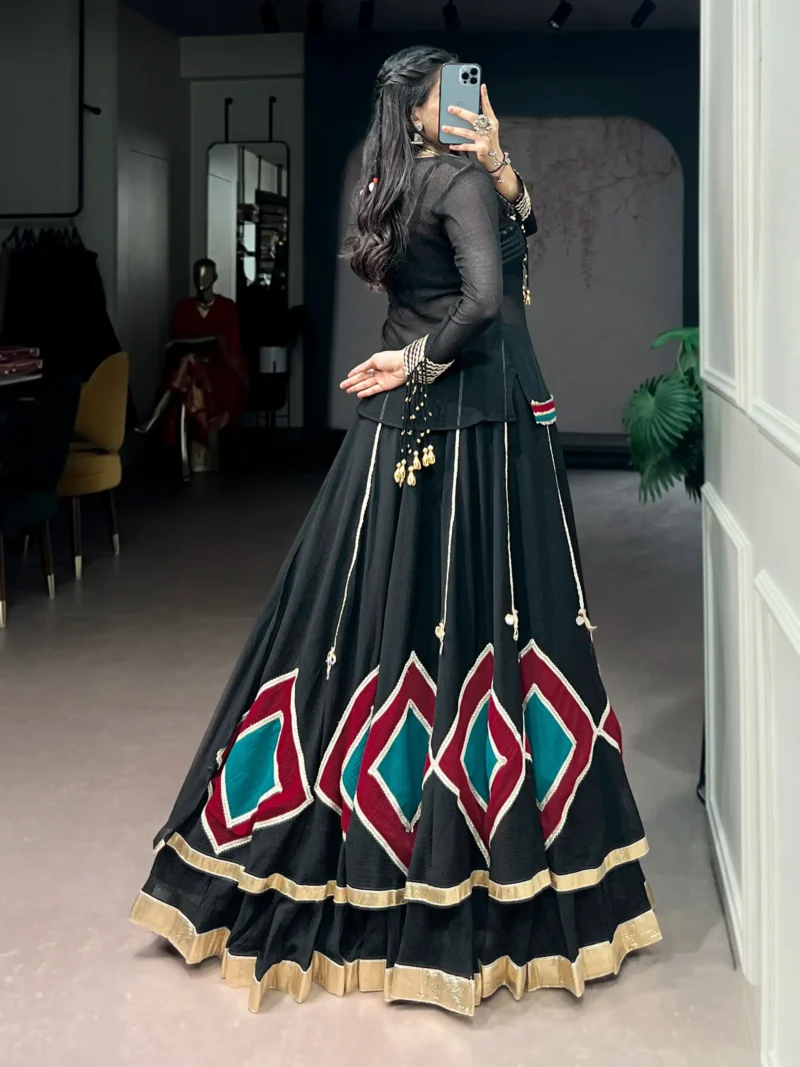 Black Marble Navratri Lehenga with Cowrie Bell Detailing and Sheer Tunic side look