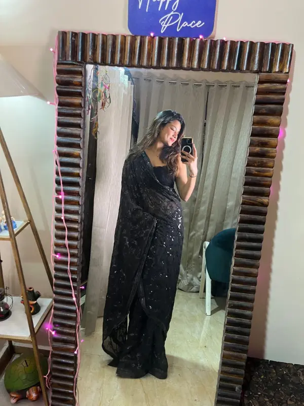 Client wearing Bella Signora black partywear saree