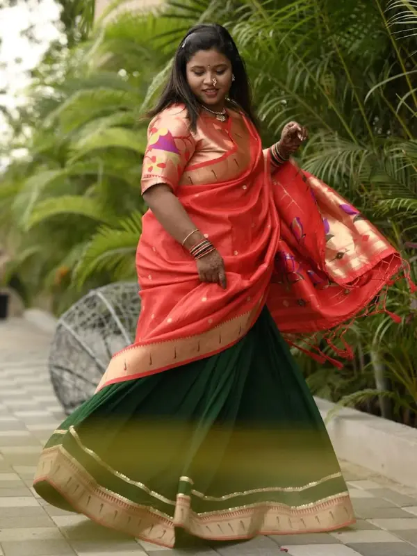 Client wearing Bella Signora green half saree lehenga