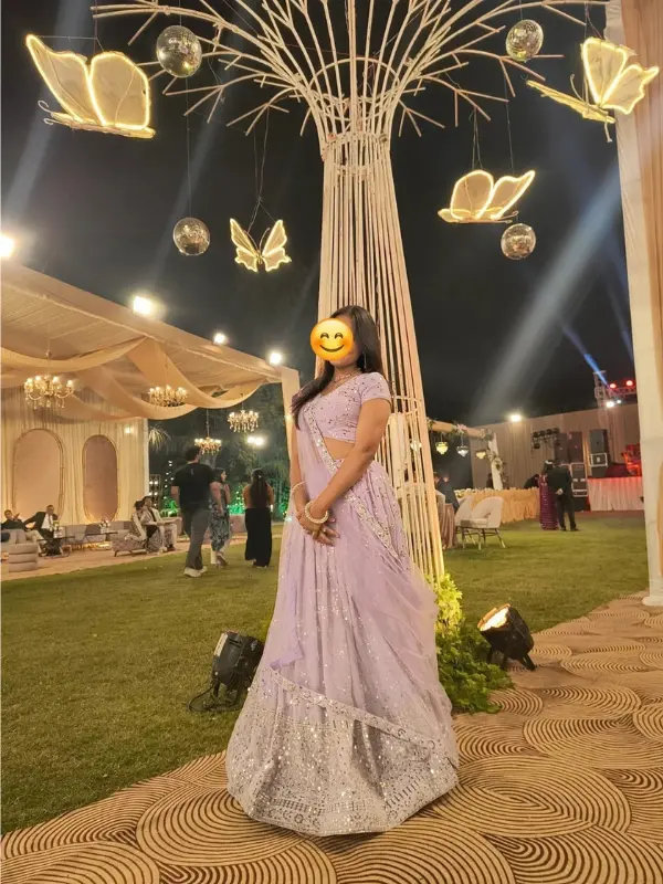 Client wearing Bella Signora partywear peach lehenga