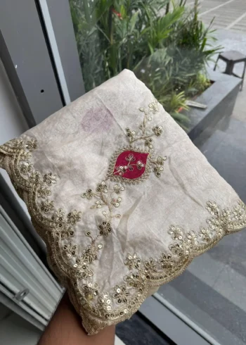 Off White Designer Fendy Satin Silk Wedding Saree in hand