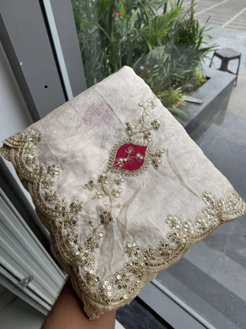 Off White Designer Fendy Satin Silk Wedding Saree in hand