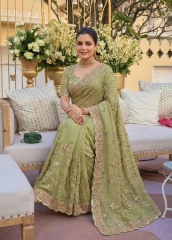 Elegant Green Star Georgette Embroidered Party Wear Saree sitting pose