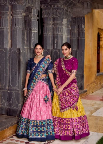 Two Girls Wearing Ikkat Print Tasar Silk Half Saree Lehenga with Embroidery