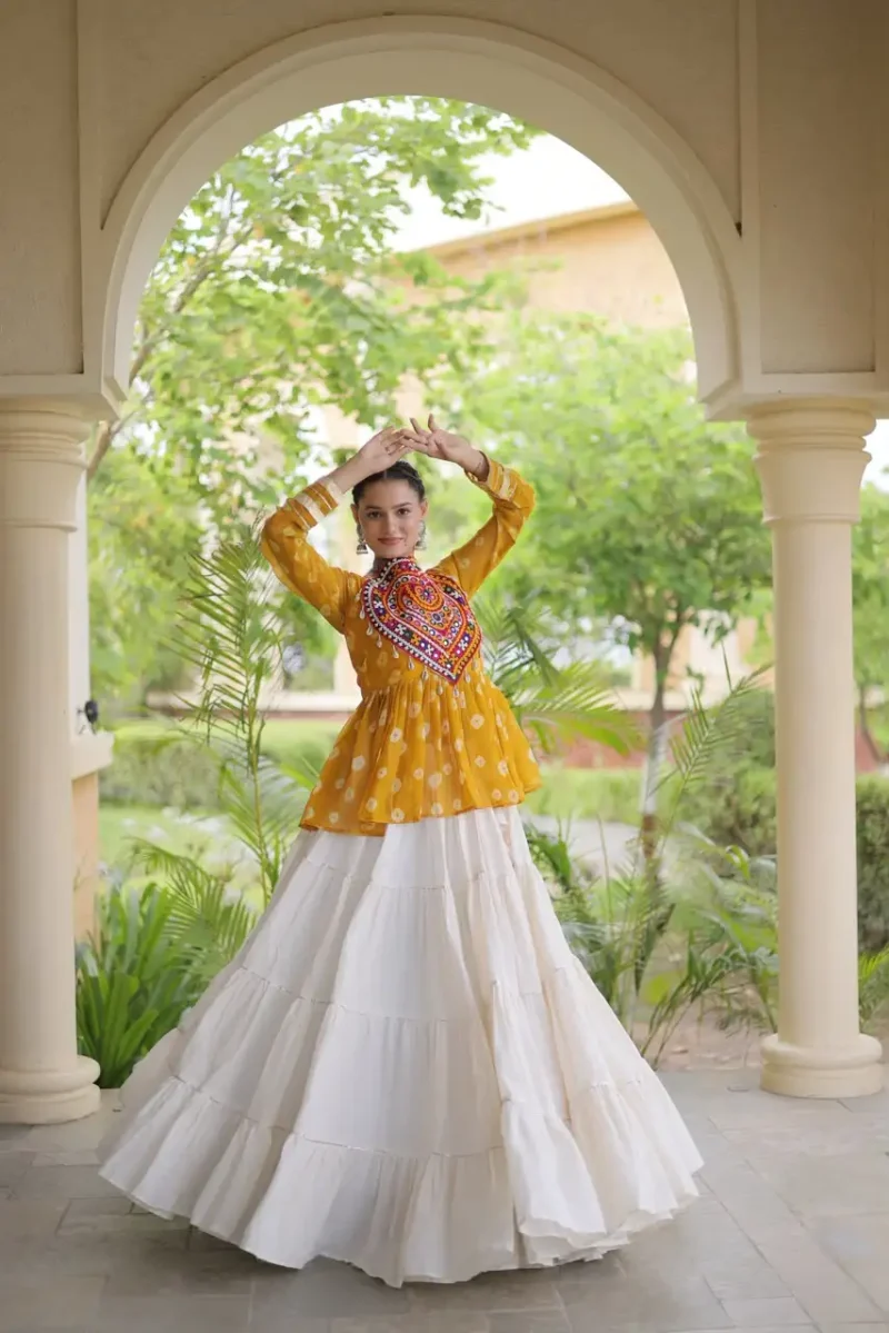 Yellow Kora Cotton Bandhni Print Navratri Lehenga with Kutchi Gamthi Top front look