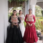 Three Girls wearing Kutchi Gamthi Mirror Work Navratri Gown with 12 Meter Flair