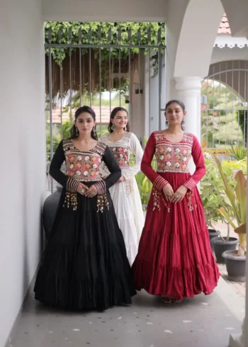 Three Girls wearing Kutchi Gamthi Mirror Work Navratri Gown with 12 Meter Flair