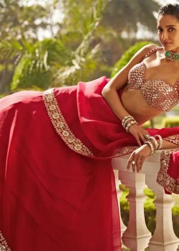 Luxury Red Organza Silk Wedding Lehenga Choli with Paper Mirror Work lying pose