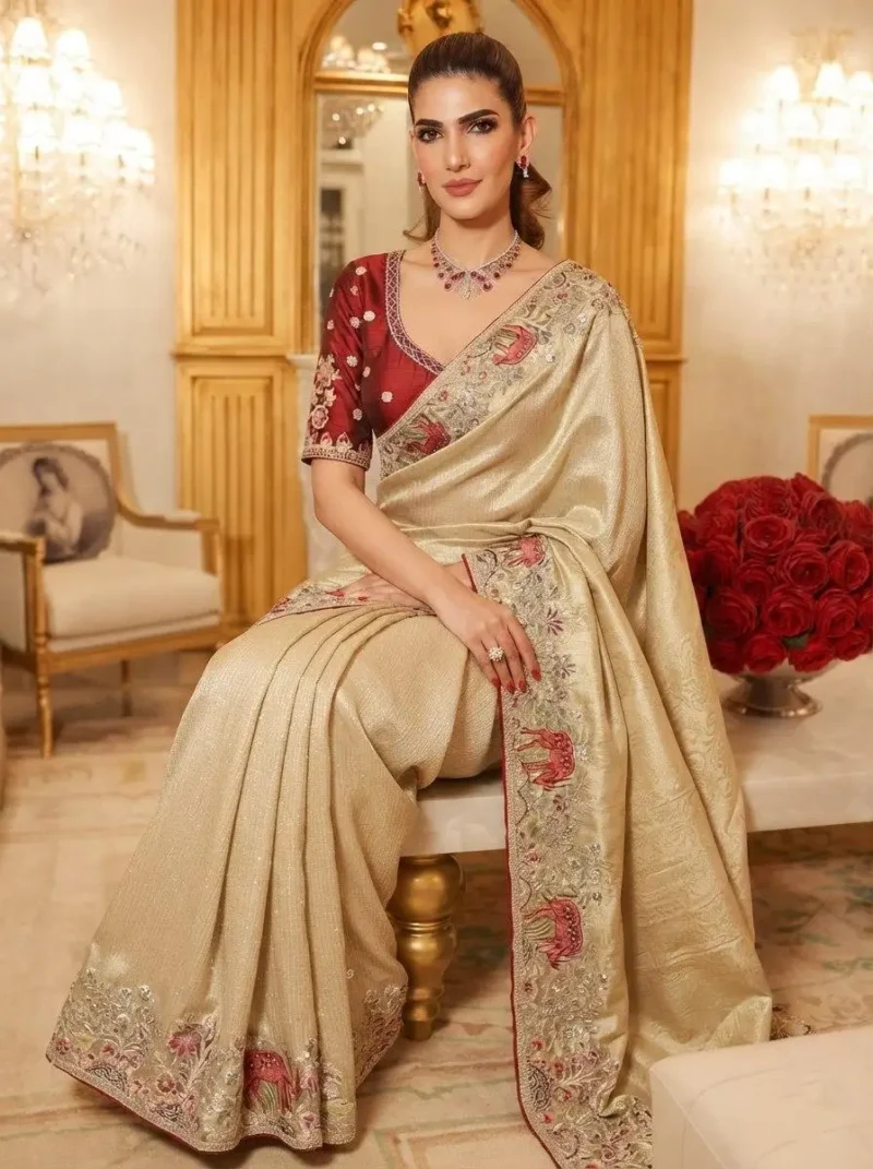 Beige Kanjivaram Silk Heavy Embroidered Wedding Saree sitting pose