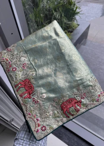 Grey Kanjivaram Silk Heavy Embroidered Wedding Saree in hand