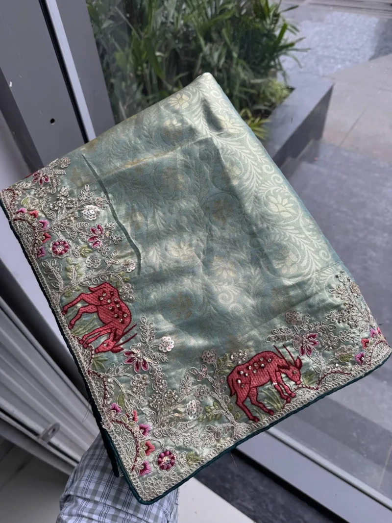 Grey Kanjivaram Silk Heavy Embroidered Wedding Saree in hand