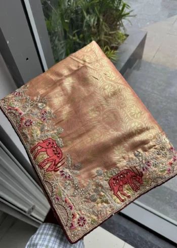 Peach Kanjivaram Silk Heavy Embroidered Wedding Saree in hand